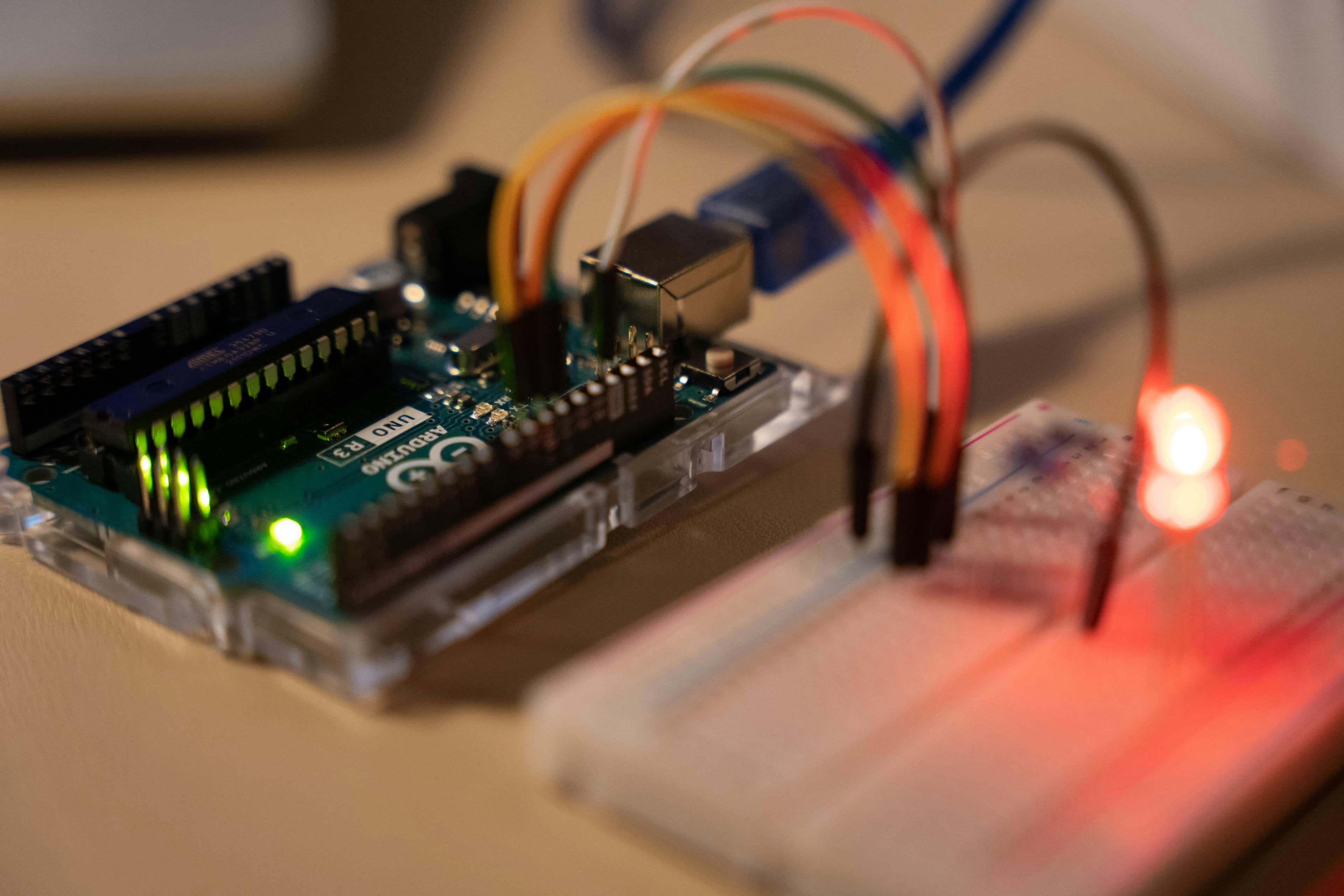 Arduino microcontroller connected to a breadboard with sensors and indicator lights